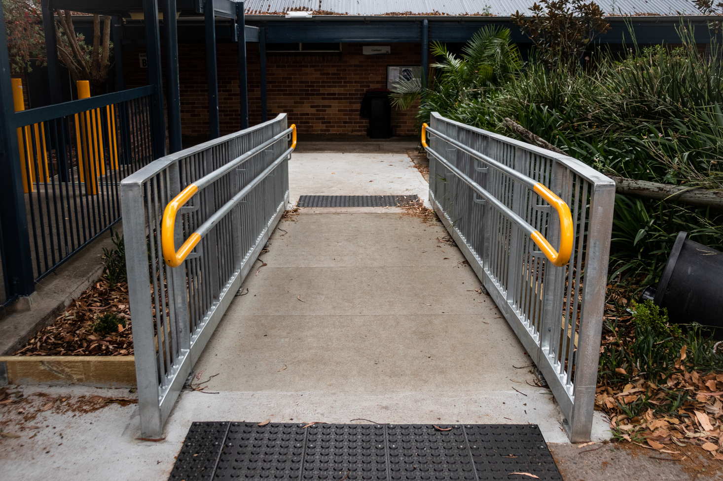 Custom-engineered access ramp solution for complex site layout, fabricated and installed by ARAS